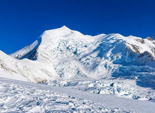 Himlung Himal Expedition camp surrounded by snow-covered Himalayan peaks in Nepal.