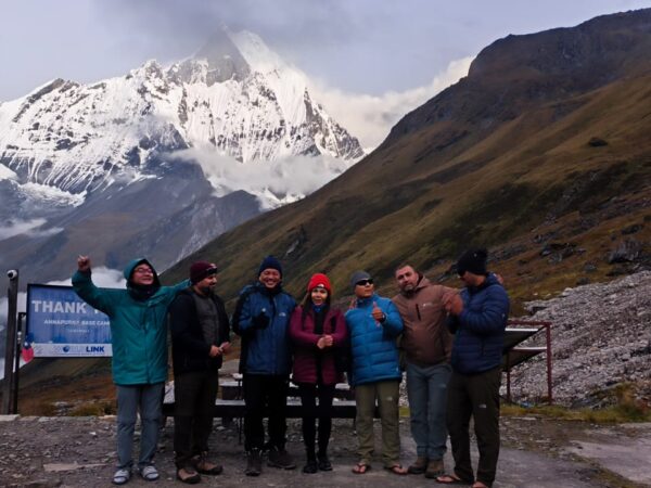 A group of trekkers posing at Annapurna Base Camp