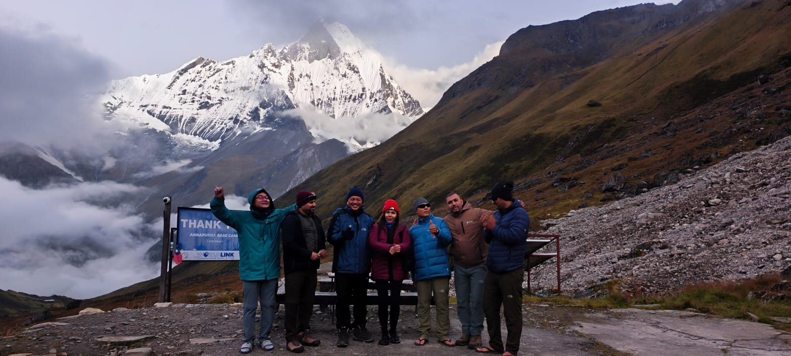 A group of trekkers posing at Annapurna Base Camp