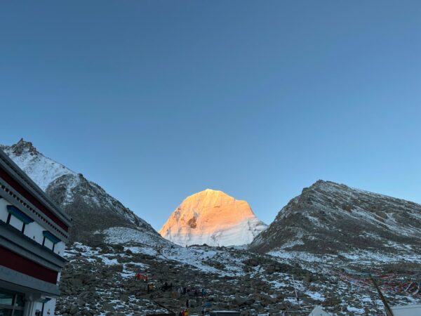 Colorful prayer flags covering the rocky terrain near Mount Kailash.