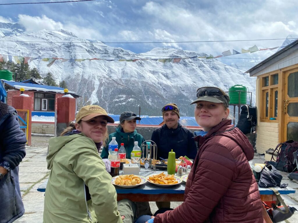 Trekkers enjoying food on the Annapurna Circuit Trek